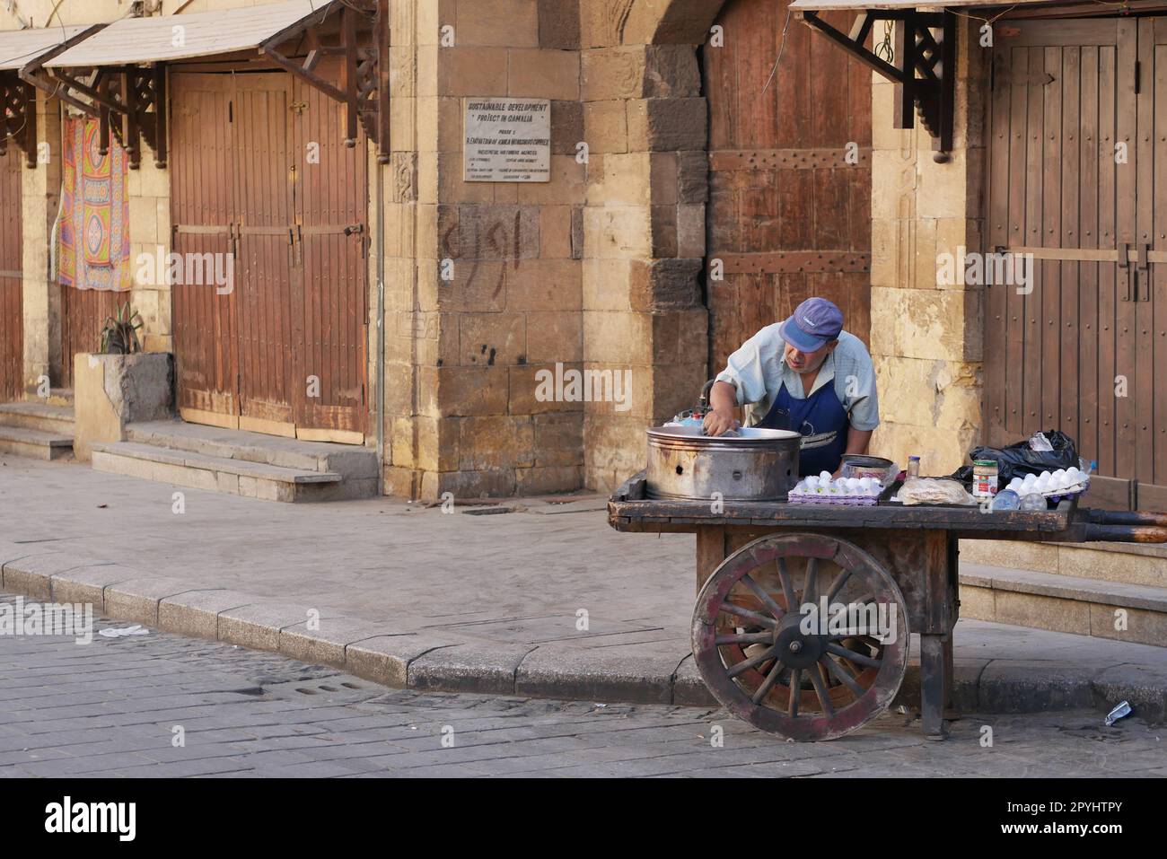 Male street vendor cooking eggs on the streets of the Islamic quarter in Cairo Stock Photo Alamy