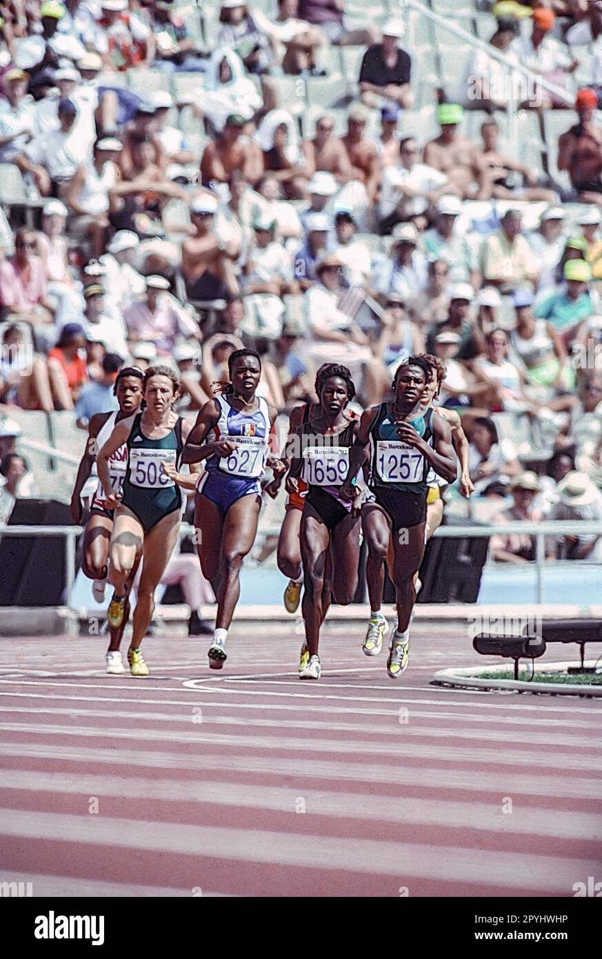 Maria Mutola (MOZ) #1257, Viviane Dorsile (FRA) #627, Lyubov Gurina (EUN) #508 in the first round heat of the Women's 800 meters at the 1992 Olympic Summer Games. Stock Photo