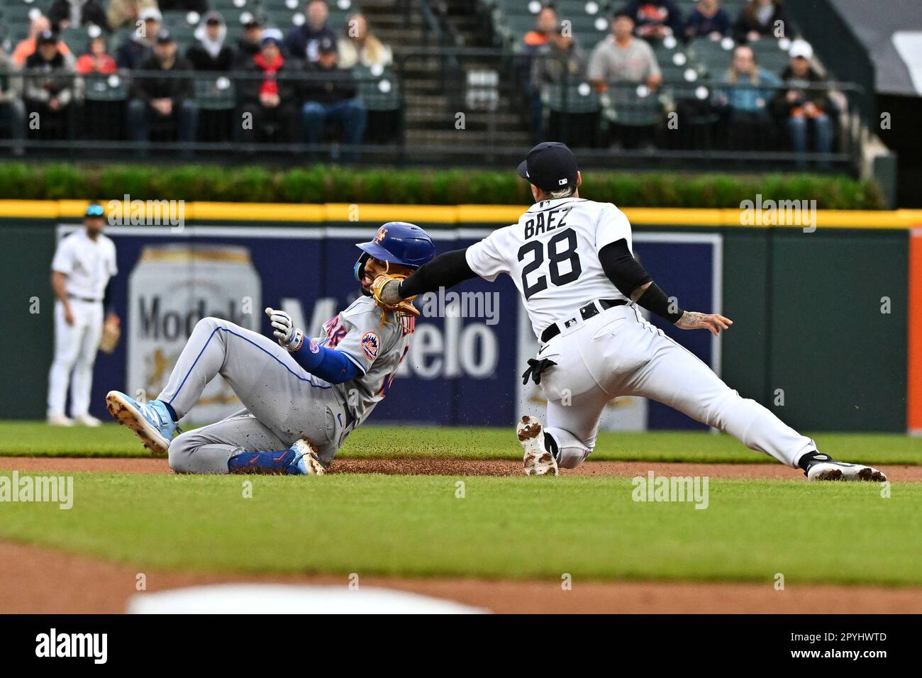 DETROIT, MI - MAY 03: Detroit Tigers shortstop Javier Baez (28) applies the  tag as New York Mets shortstop Francisco Lindor (12) tried to stretch a  single into a double during the