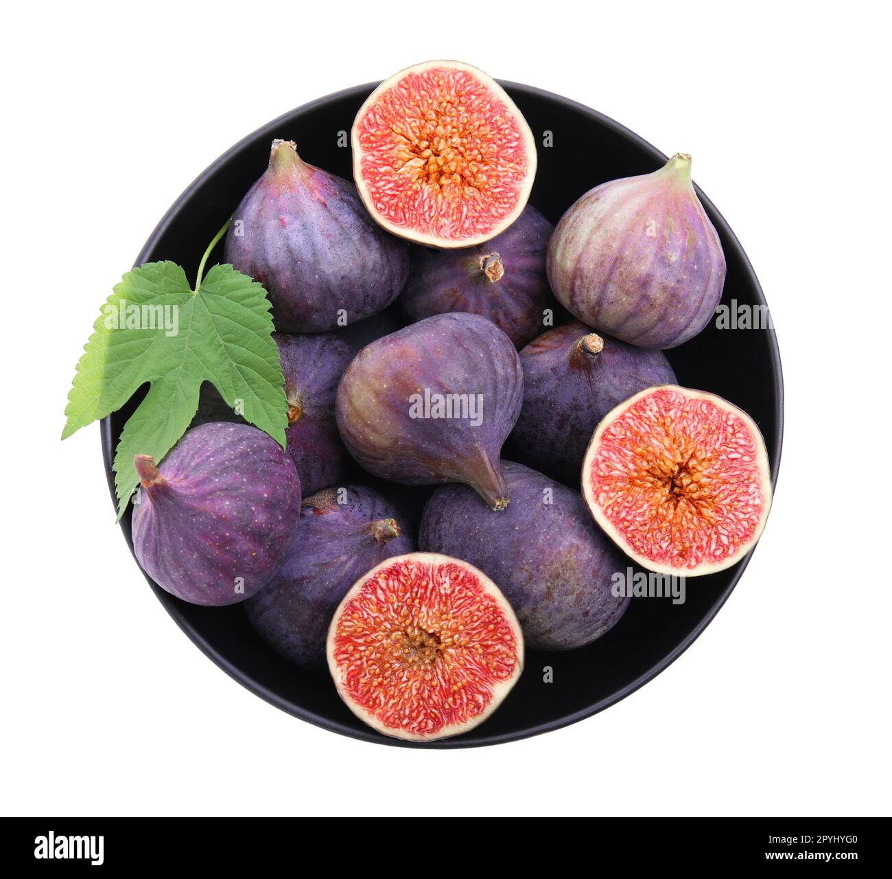 Whole and cut fresh purple figs in bowl isolated on white, top view
