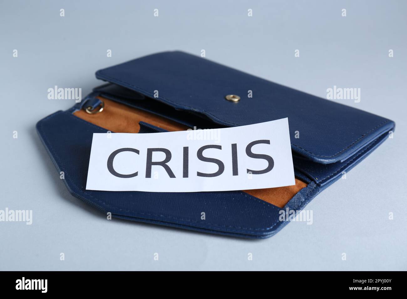 Purse with word Crisis on white background Stock Photo - Alamy