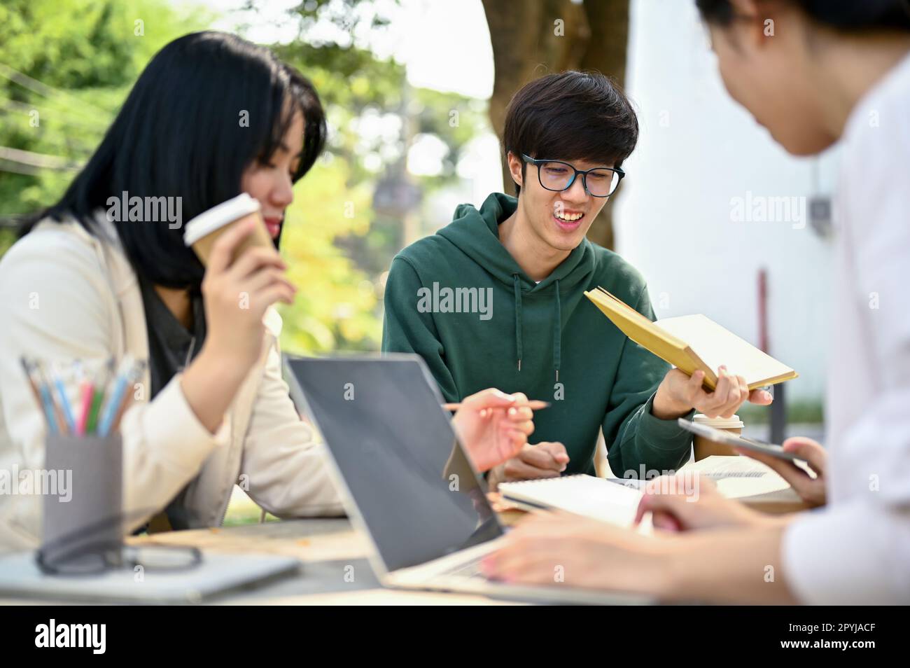 Nerd and smart young Asian male college student tutoring math to his ...