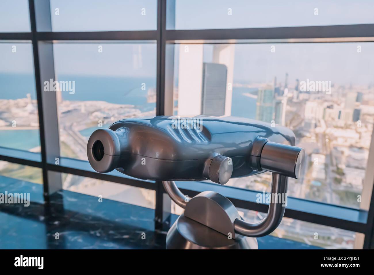 Tourist optical telescope on the observation deck viewpoint overlooking