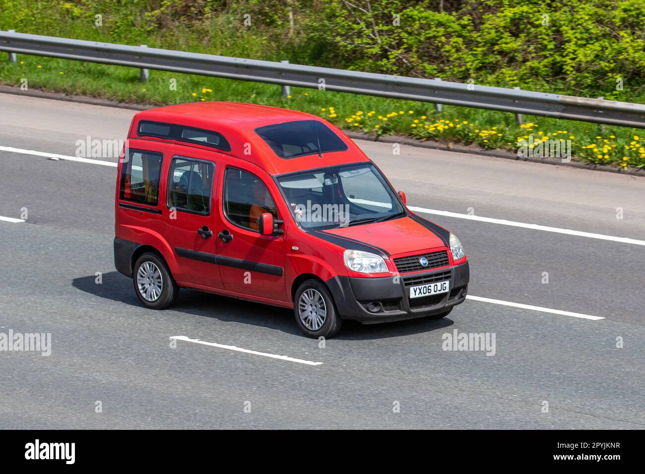 2006 Red Fiat Doblo Active Car Small MPV Petrol 1368 cc;  travelling on the M61 motorway UK Stock Photo