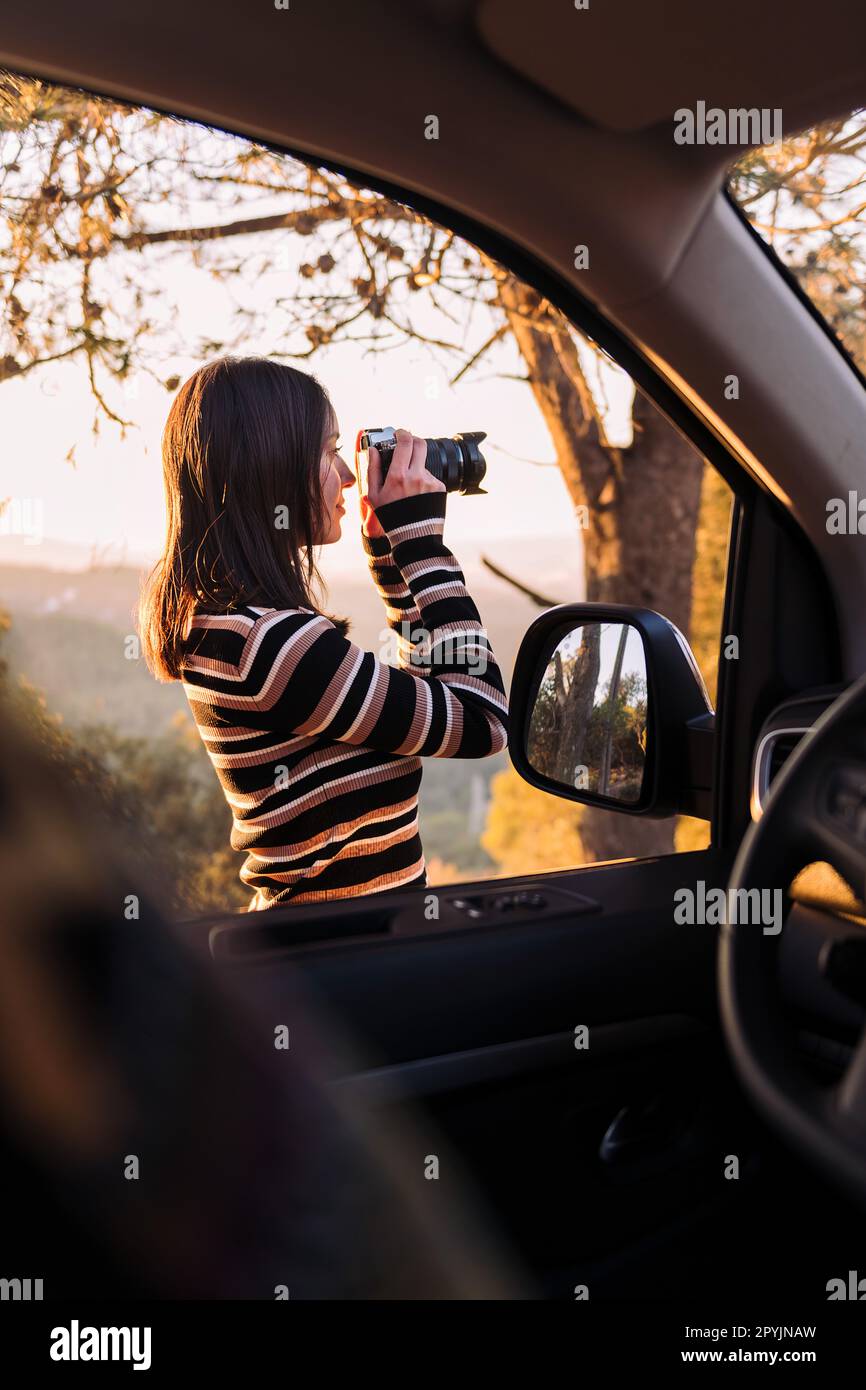 woman taking photos of nature during a road trip Stock Photo - Alamy