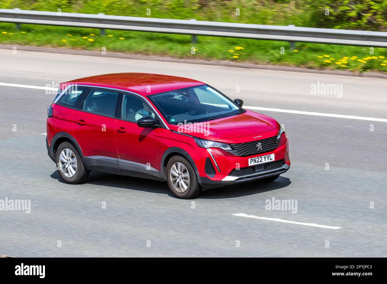 2022 Red Peugeot 5008 Active Premium P-Tech Ss Puretech E-THP 130 Start/Stop  Car SUV Petrol 1200 cc;  travelling on the M61 motorway UK Stock Photo