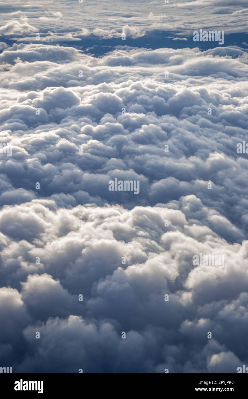 Aerial view of puffy white clouds in the sky with copy space. Stock Photo