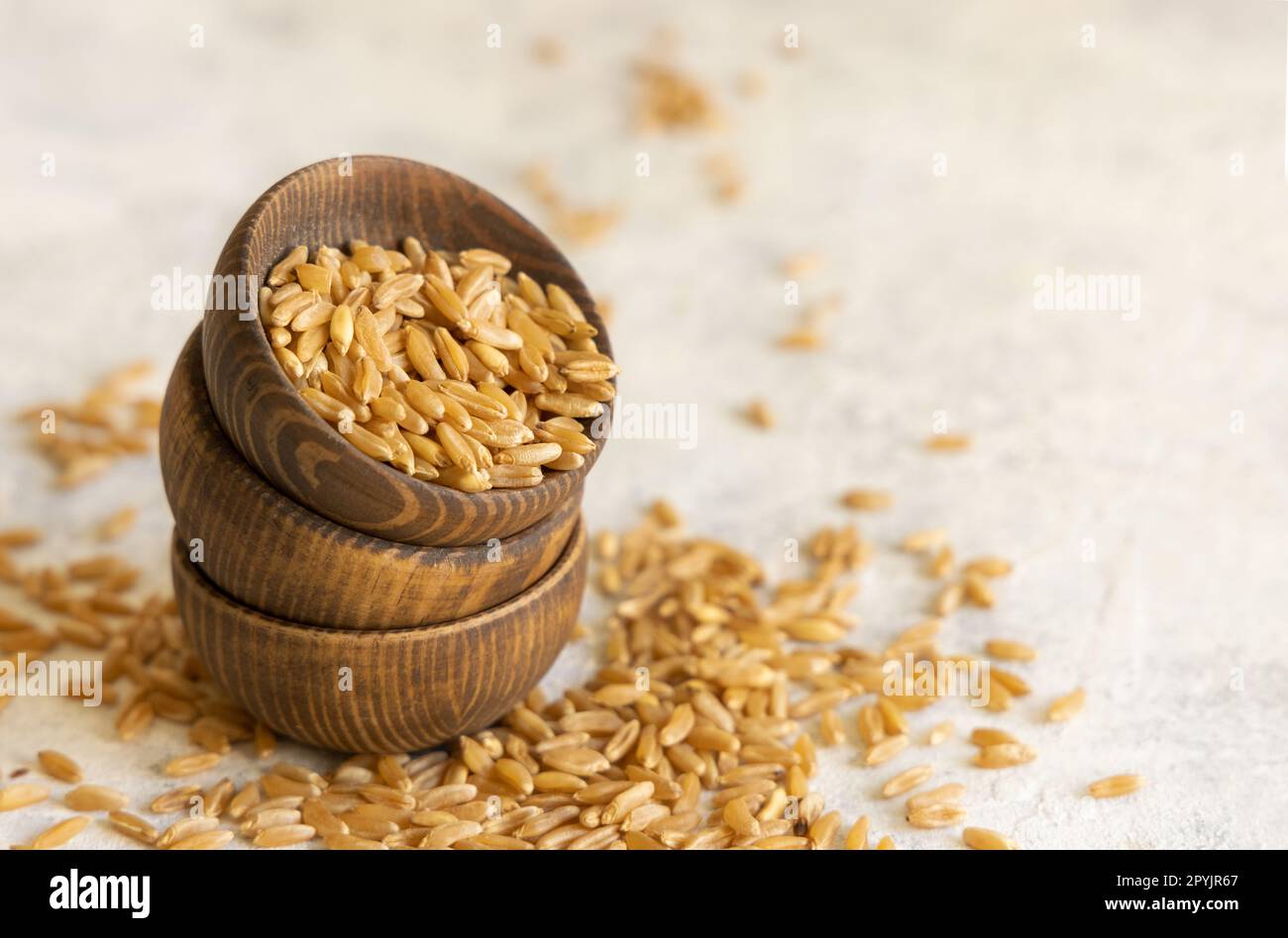 Uncooked Rye Dry food grain ingredient pile raw uncooked white wooden hi-res stock ...
