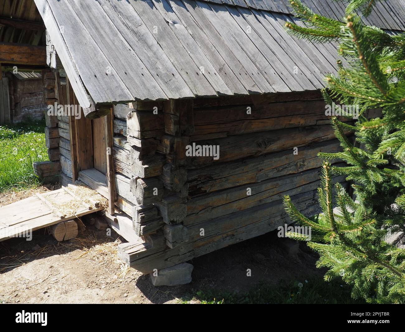 Log village farmhouse. 19th century Bosnian mountain traditional dwelling. Restored ethno building. The old way of village life. House of the witch in the woods Stock Photo