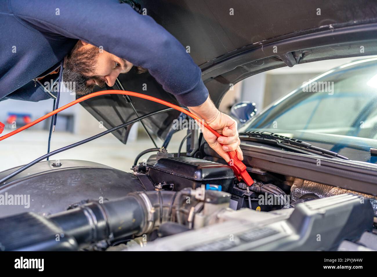 charging the car battery using electric cables Stock Photo Alamy