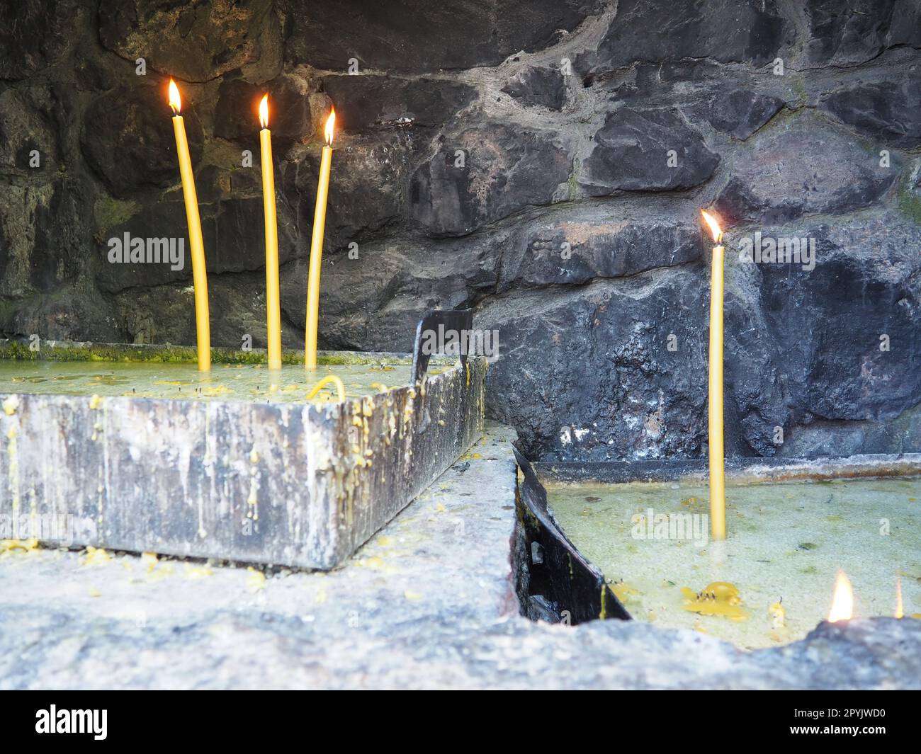 Burning candles for peace or health. Church religious rite. Three ...