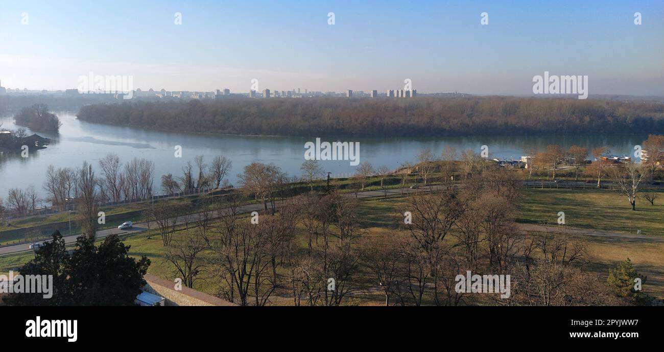 Belgrade, Serbia. View from Kalemegdan to the Danube River and Ratny Island. The confluence of the Sava and Danube rivers. Autumn-winter time. Landscape - banner. Stock Photo