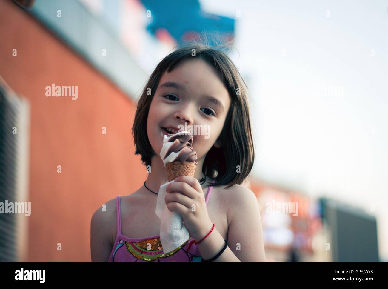 Little girl eating ice cream outdoors Stock Photo Alamy