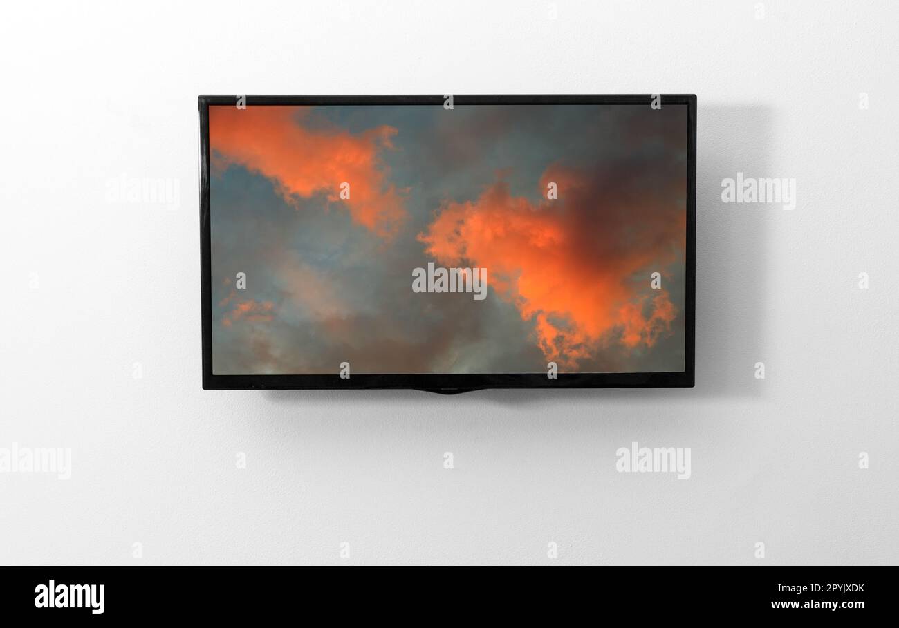 TV monitor with picture on the wall Stock Photo