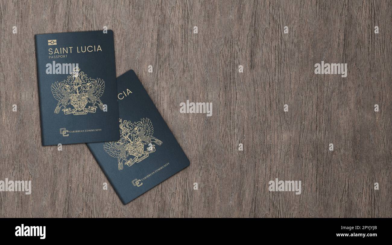 New Saint Lucia passports on a wooden background Stock Photo