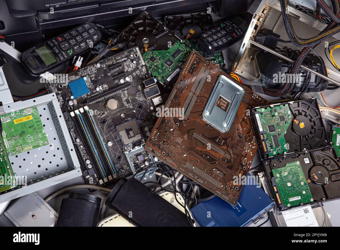 Heap of old computer devices and hardware parts for disposal and
