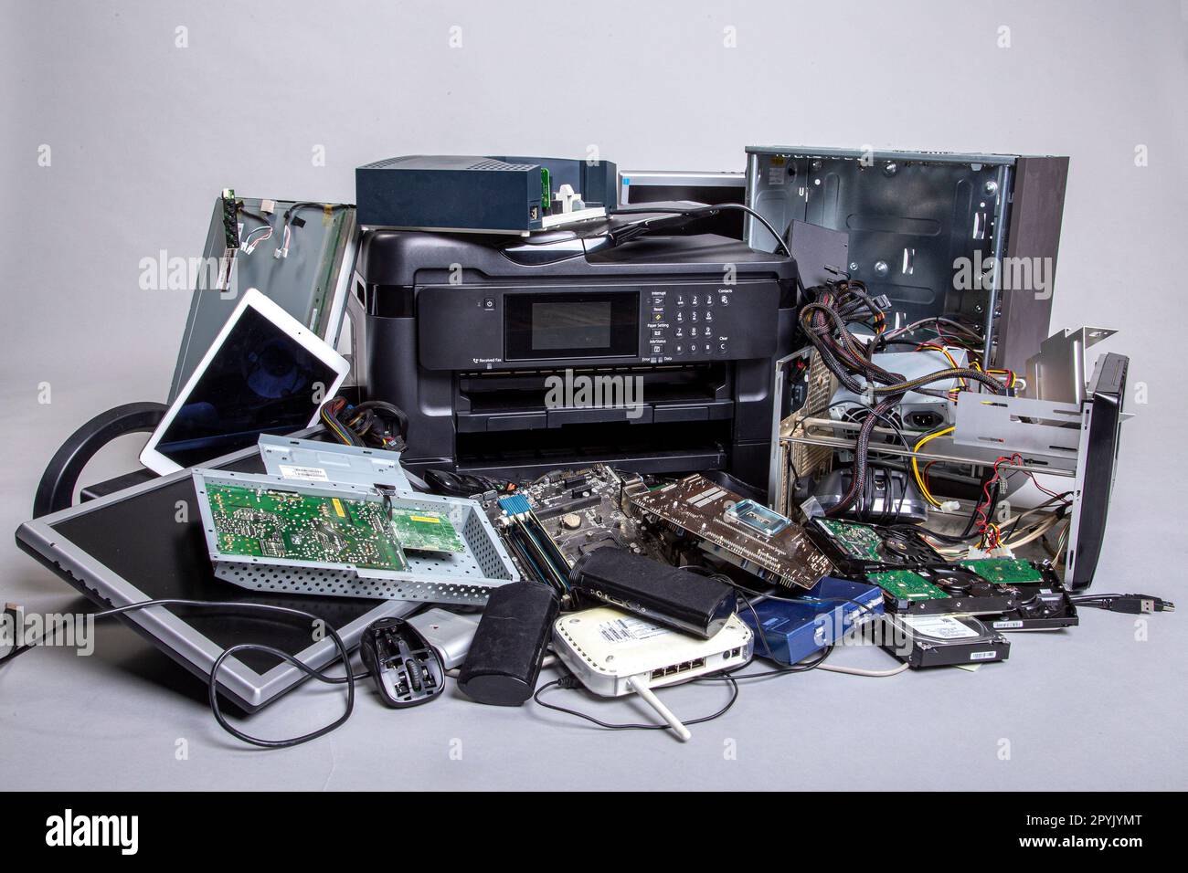 Heap of old computer devices and hardware parts for disposal and