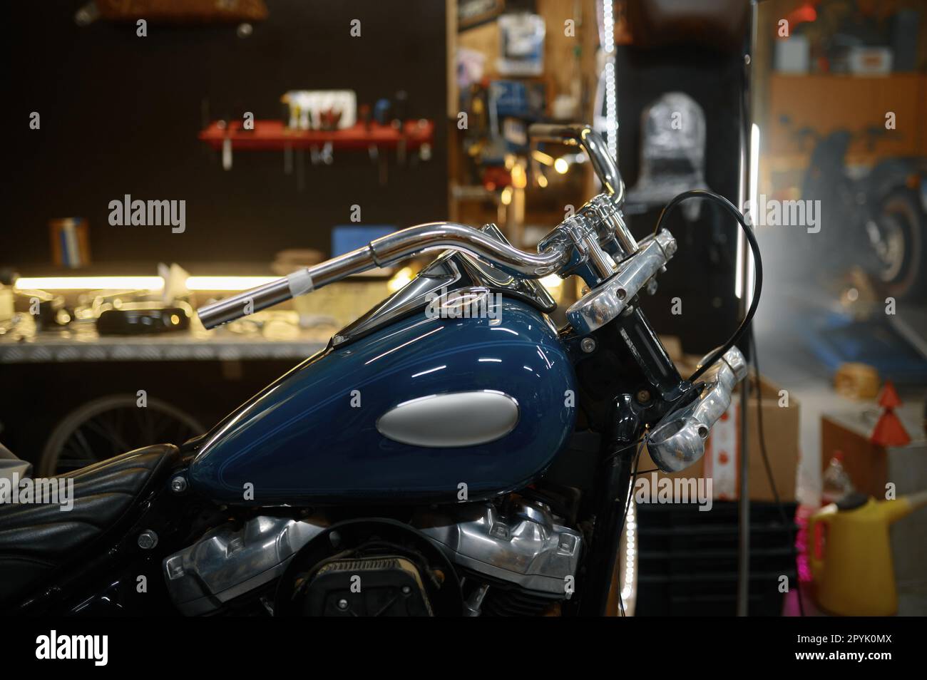 Polished, refurbished biker motorcycle in garage workshop Stock Photo