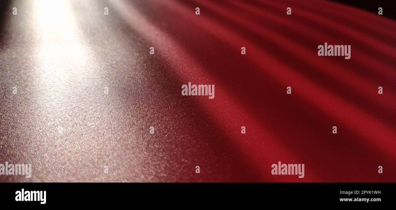 blurred striped red background. Play of light and shadow. Light rays. Divine or heavenly radiance from above. Simulate lighting something from above with spotlights. Copy space. Stock Photo