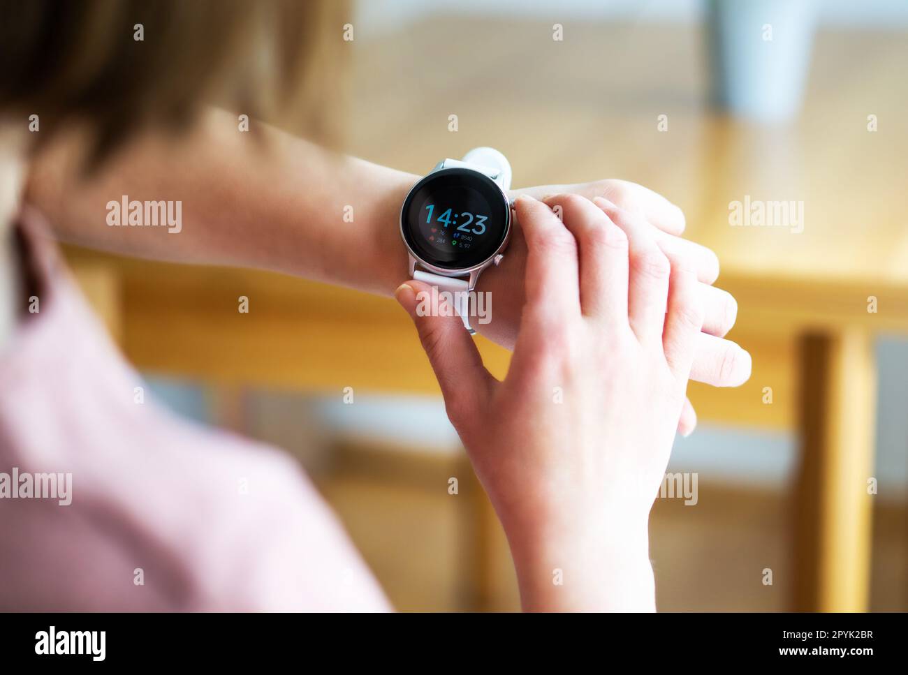 Hands of woman wearing smart watch. Technology, business and people concept. Modern lifestyle. Stock Photo