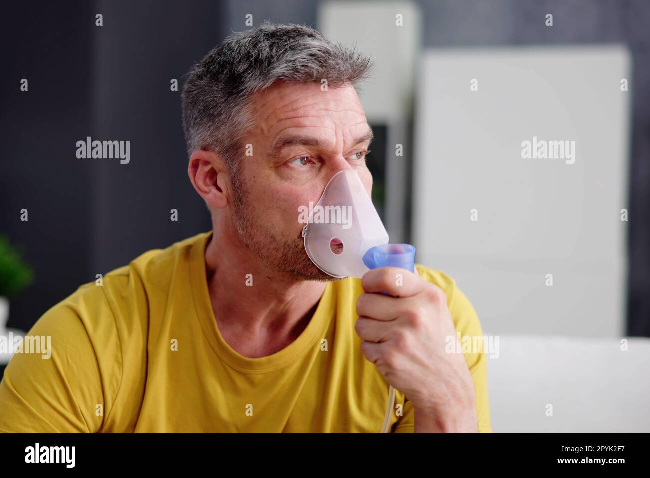 Asthma Patient Breathing Using Oxygen Mask Stock Photo - Alamy