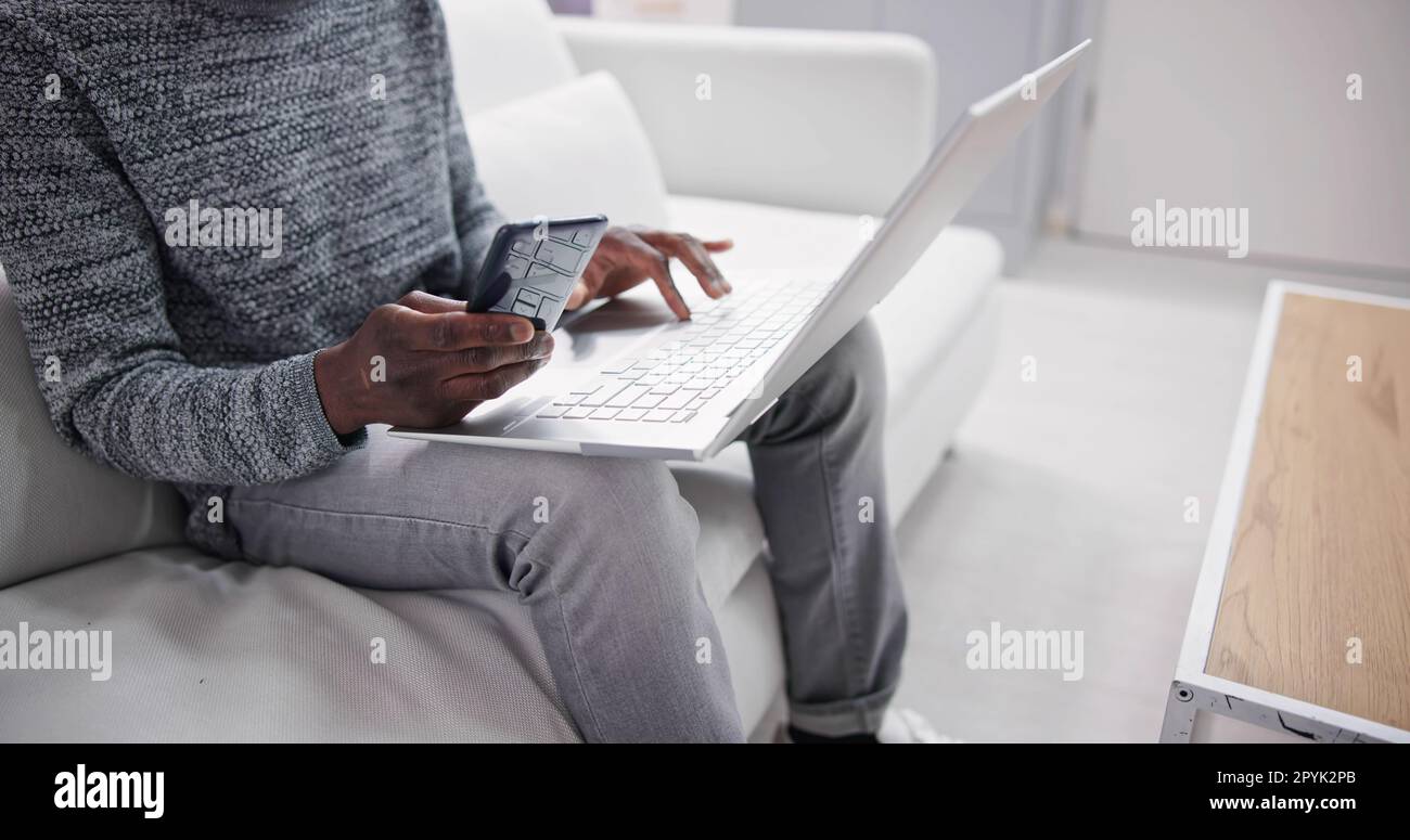 Sitting Home Using Computer Technology Stock Photo - Alamy