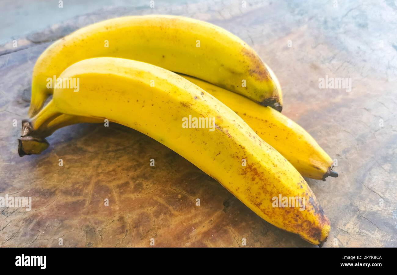 Bananas banana fruit fruits on wooden table Puerto Escondido Mexico