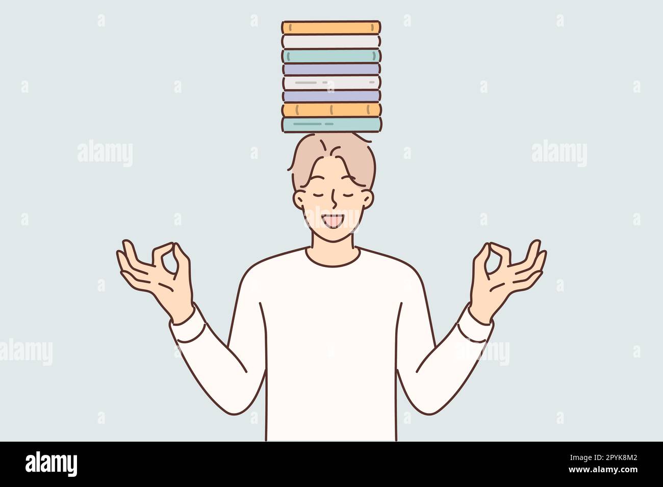 Meditating man with books on head stands with eyes closed trying to maintain balance between study and rest. Young guy student or high school student Stock Photo