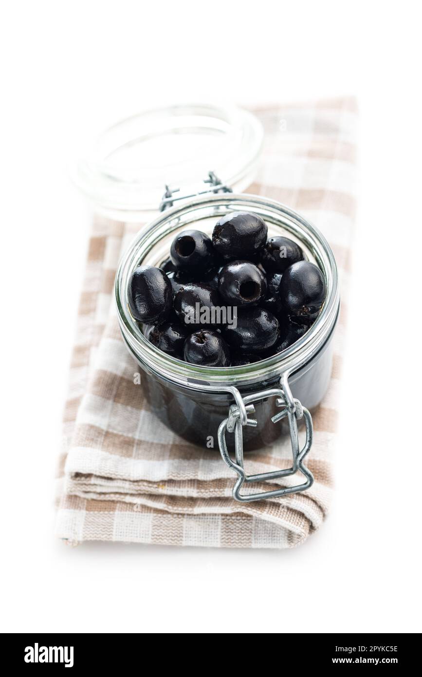 Pitted black olives in jar isolated on the white background. Stock Photo