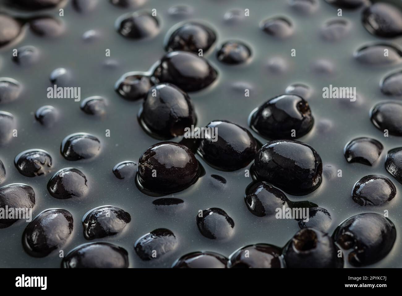 Pitted black olives. Marinated olives in the pickle Stock Photo Alamy