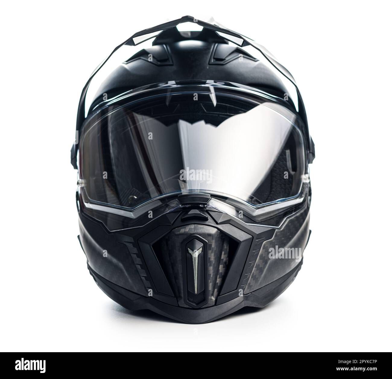 Black carbon motorcycle helmet. Offroad motocross helmet with shield isolated on white background. Stock Photo