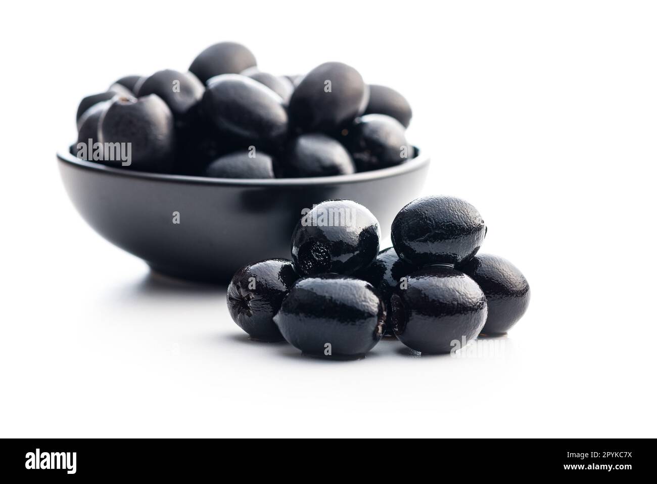 Pitted black olives isolated on white background. Stock Photo