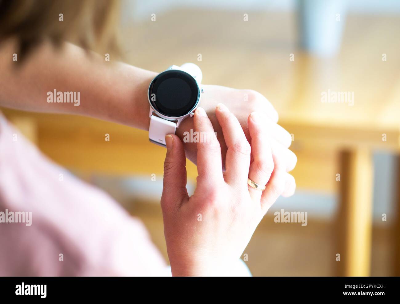 Hands of woman wearing smart watch. Technology and business concept. Modern lifestyle. Stock Photo