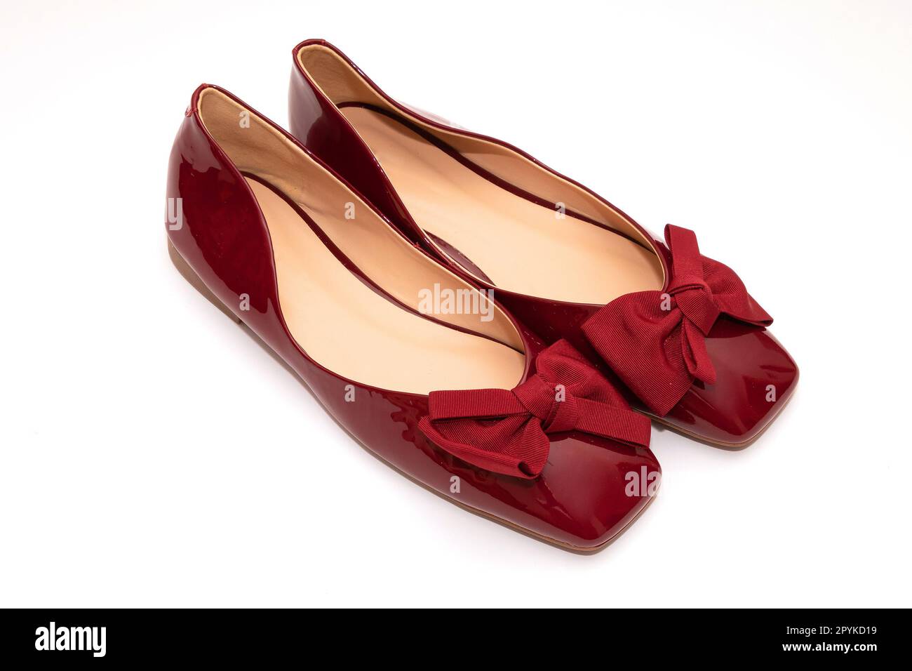 Red  patent leather shoes on white Stock Photo