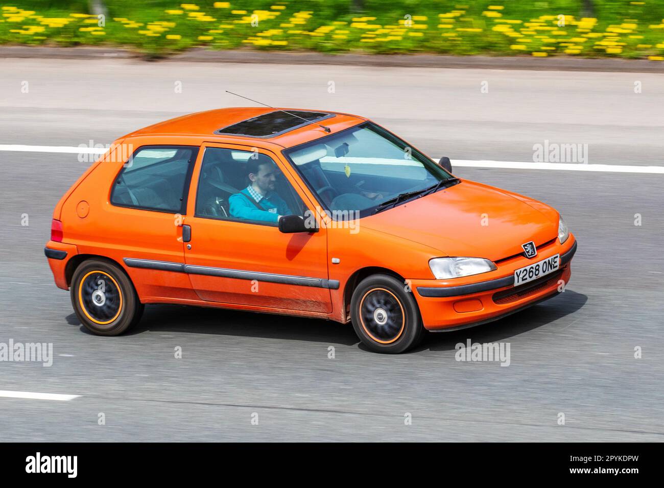 2001 Peugeot 106 Independence Orange Car Hatchback Petrol 1124 cc;  travelling on the M61 motorway UK Stock Photo - Alamy