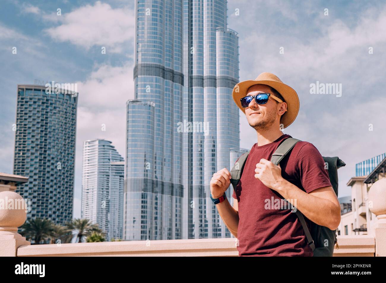 Traveler tourist man wearing hat with backpack at the background of
