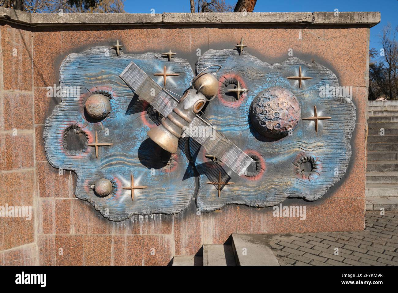 A frieze sculpture of the Soviet era space capsule Soyuz. On an exterior wall at the front entrance of the Toshkent Planetarium, Planetariy in Tashken Stock Photo