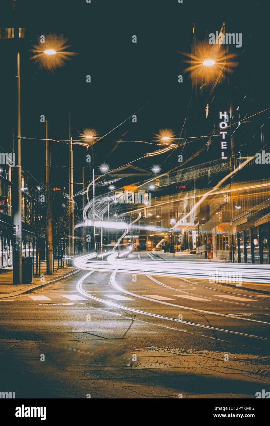 Tram and traffic light trails through an Oslo city centre. Stock Photo