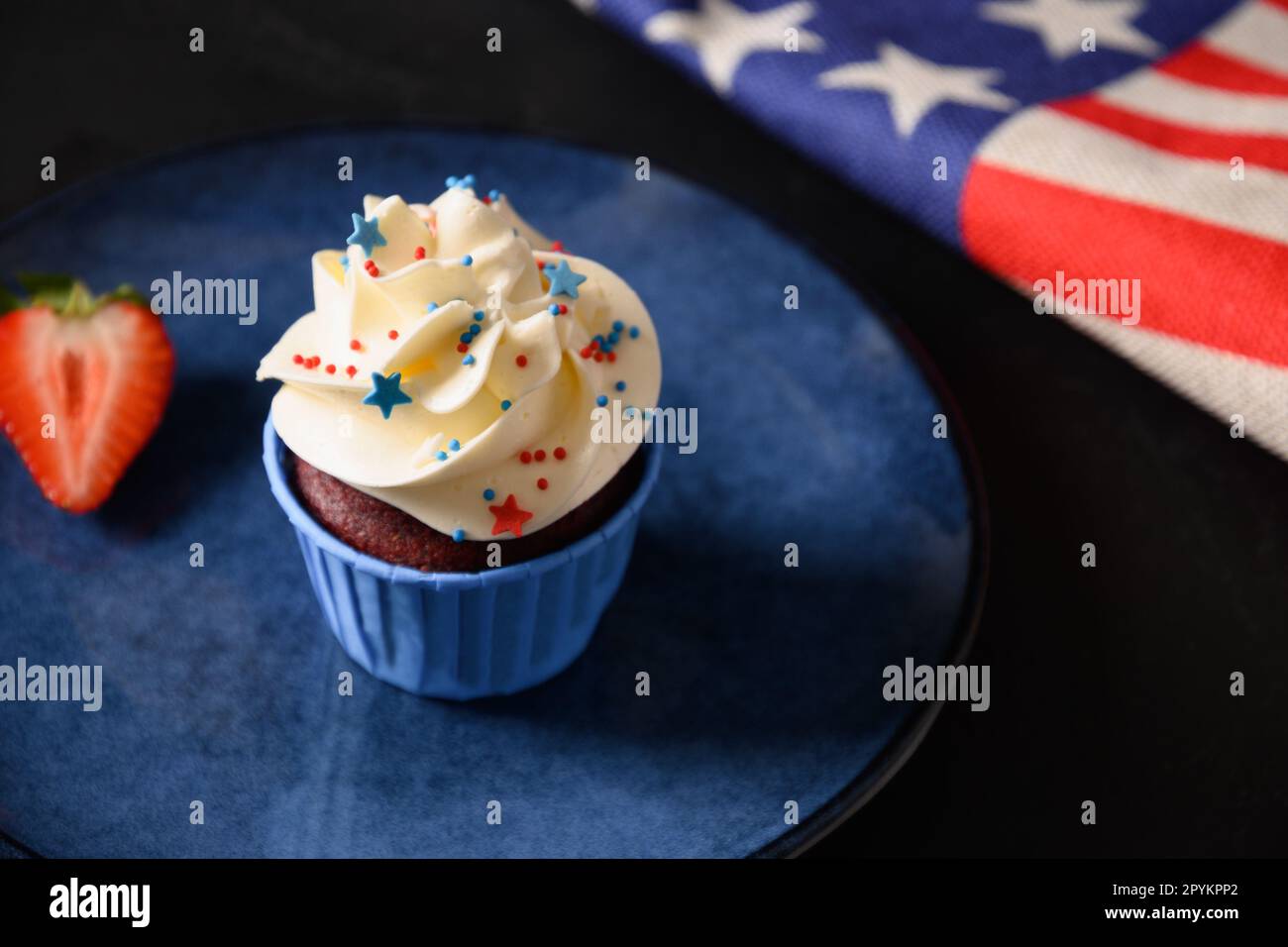 Traditional American sweet cupcake with sugar sprinkles as stars and