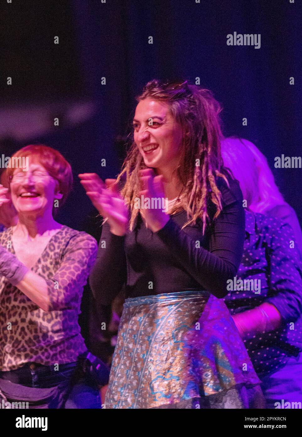 Mainly women dancers coloufully lit at the Halesworth Cut arts centre for a Kicks without Vix concert Stock Photo