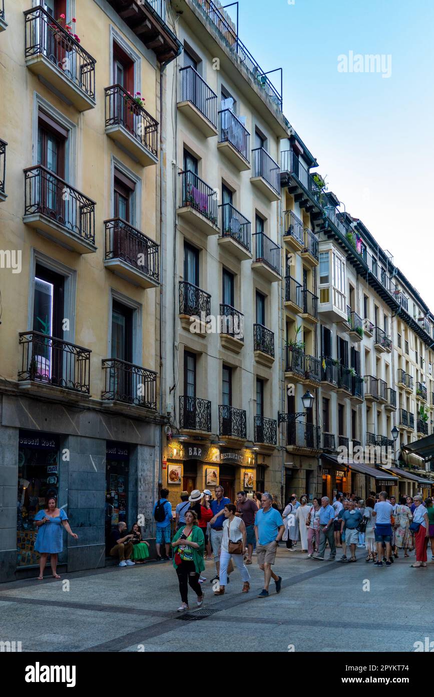 San Sebastian, SPAIN - July 09 2022 Streets of San Sebastian - Donostia. View of old town center with bars and restaurant. People passing. Stock Photo