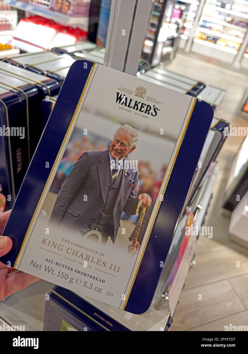 Expensive tin of King Charles III Walkers shortbread, airport duty free Stock Photo