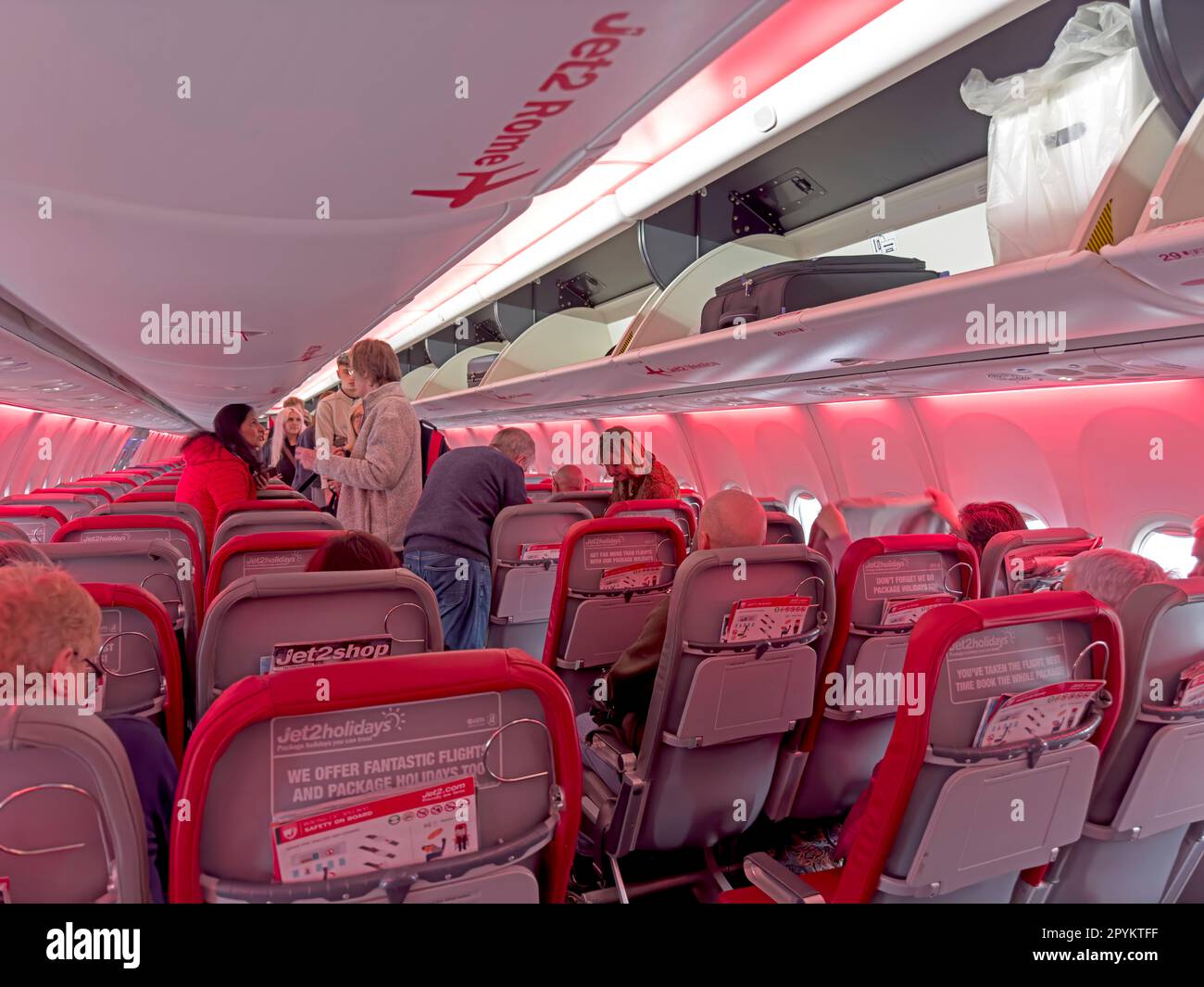 Inside a Jet2 holiday charter aircraft, boarding down the aisle Stock Photo