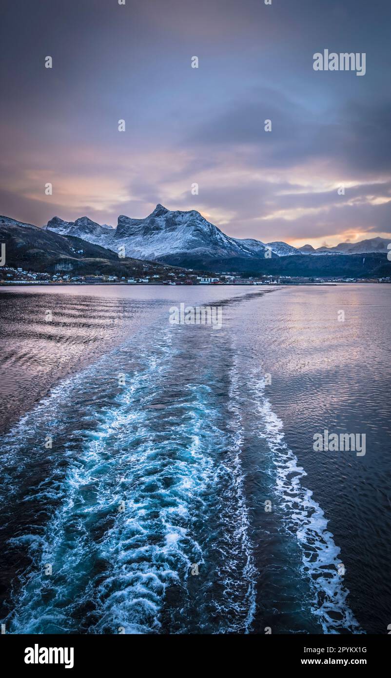 Looking down at the wake left by the Hurtigruten ship MS Polarlys as it departs Nesna, Norway. Stock Photo