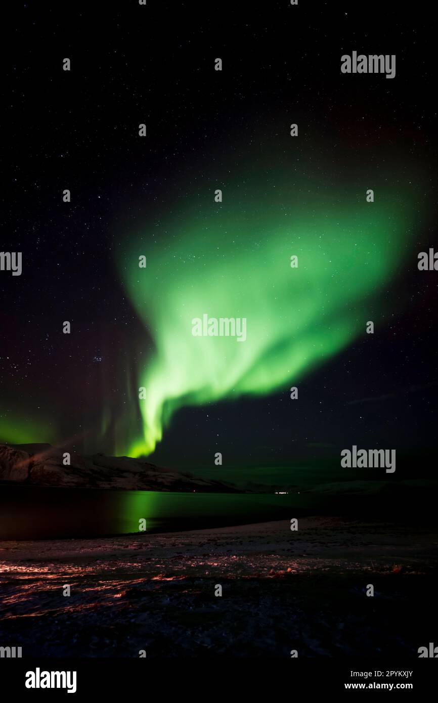 The Northern Lights dancing in the sky close to Tromso, Norway Stock
