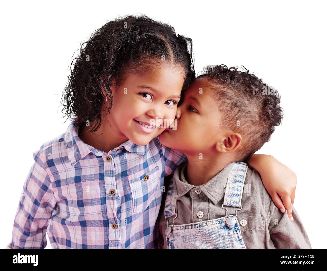 Children, brother and sister siblings kiss on cheek in family portrait with love and care. Kids, hug and smile together with support for boy and girl Stock Photo