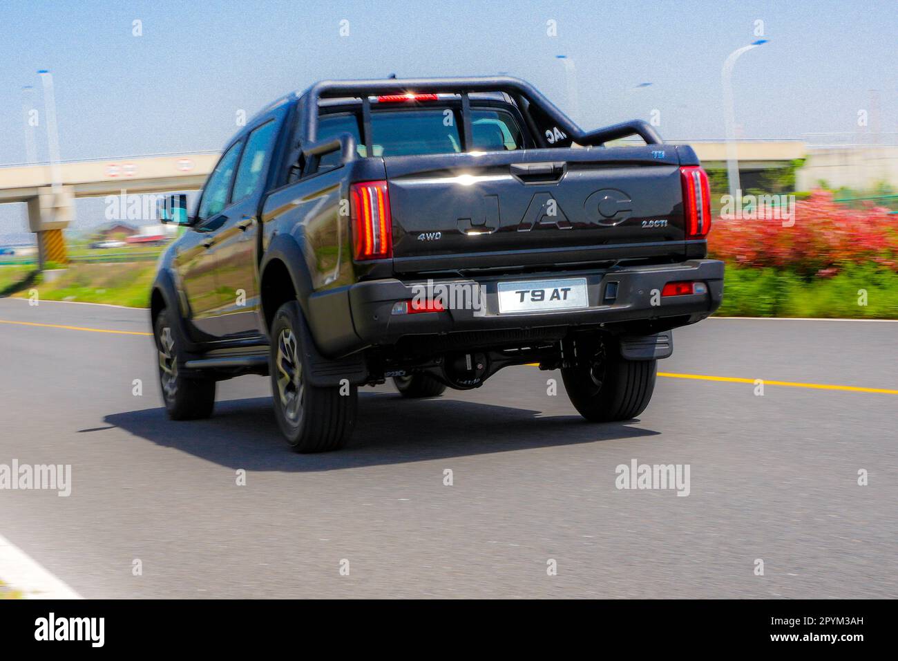Anhui Province, China – 17042023: South African spec right hand drive JAC T9 pickup truck being driven on a track during a test drive. Stock Photo