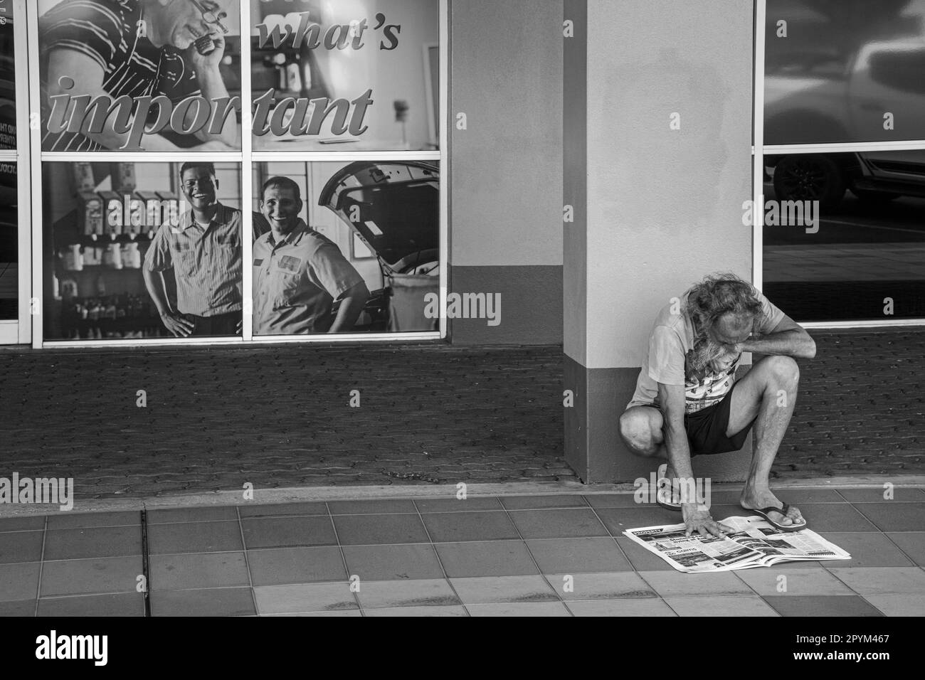 Reading a newspaper, Mareeba, Queensland, Australia Stock Photo - Alamy