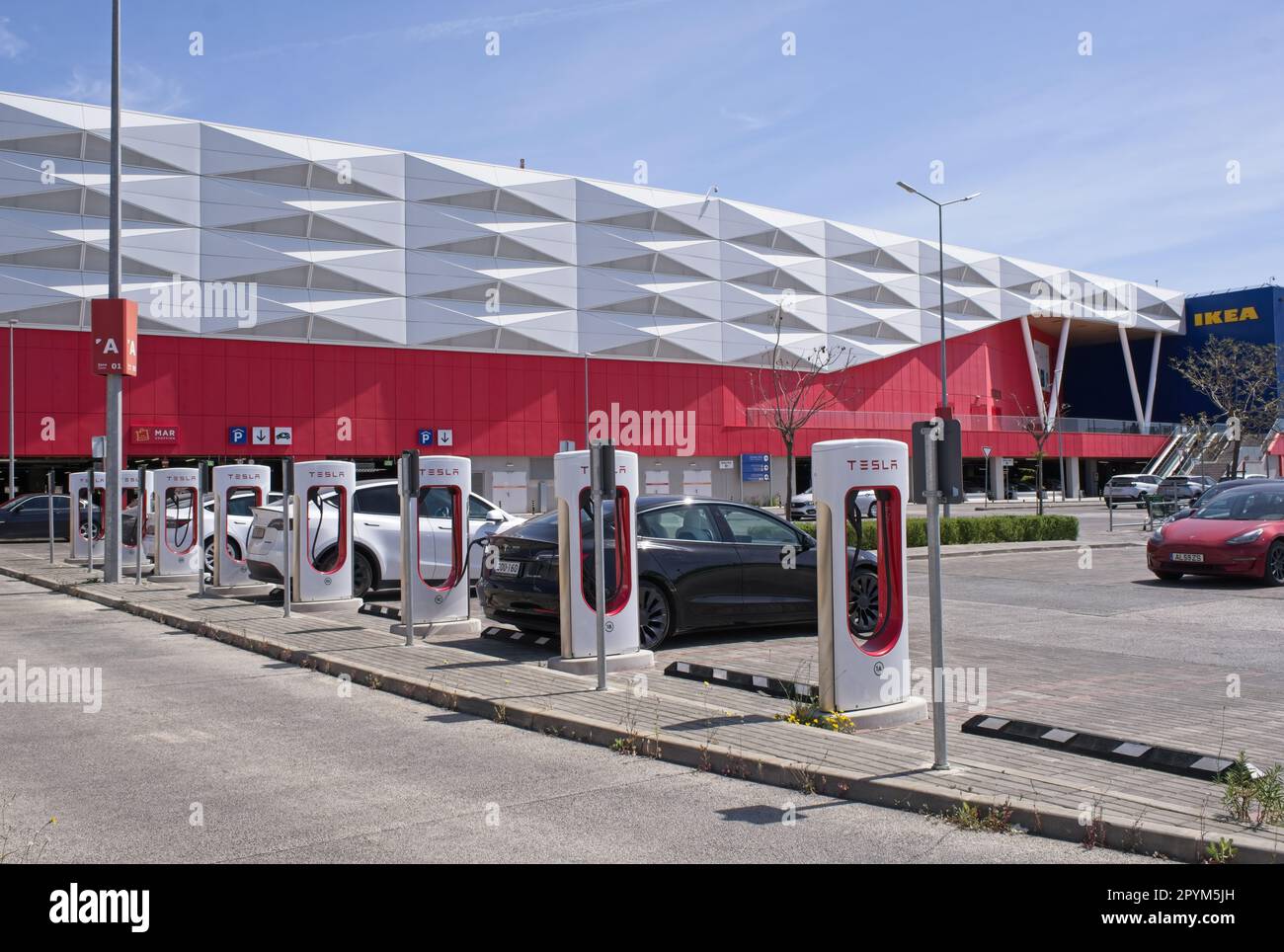 Loule, Portugal April 11, 2023 A static shot of a solid black Tesla Model 3 dual motor