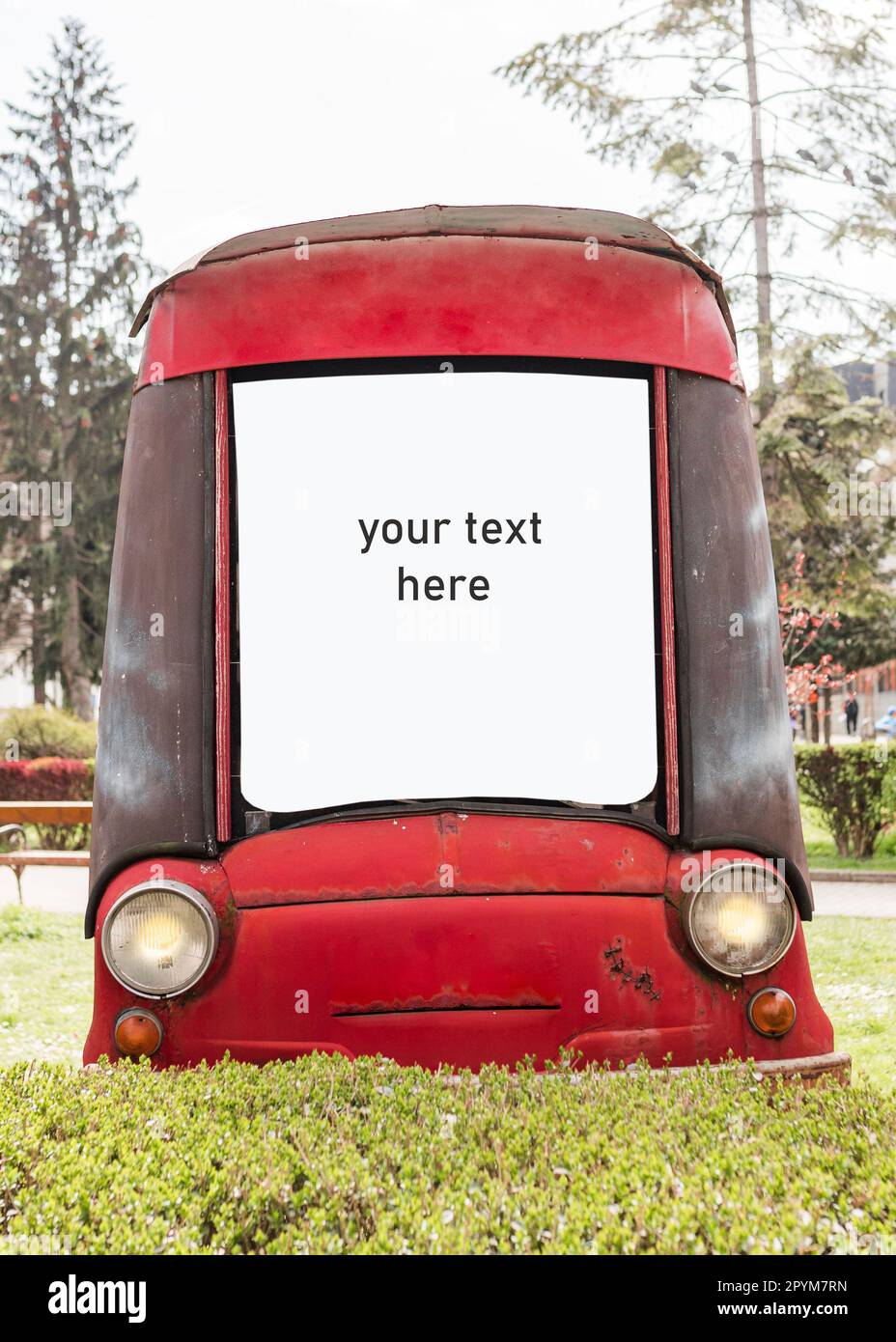 A blank billboard in the shape of an old red car in a park Stock Photo ...